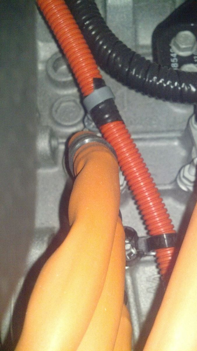 A close up of a hose connected to a motor | Autotrends