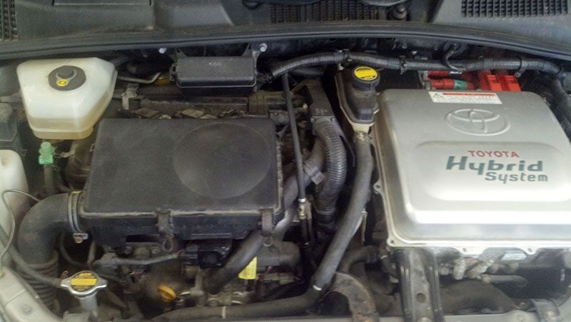 The engine of a toyota hybrid system car is shown | Autotrends
