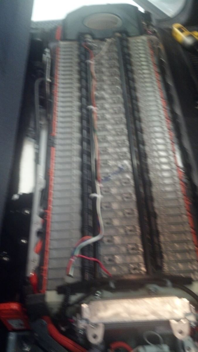 A close up of a piano keyboard with a lot of wires coming out of it | Autotrends