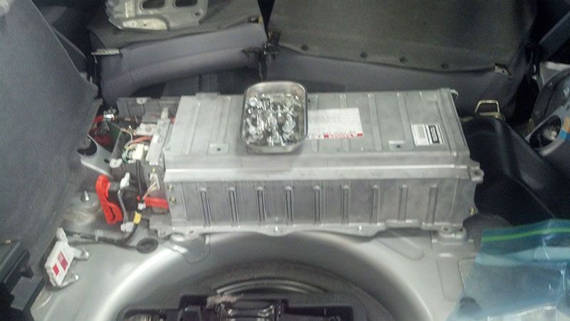 A battery is sitting in the trunk of a car | Autotrends
