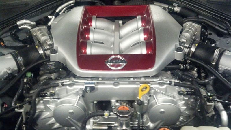 A close up of a nissan engine in a car | Autotrends