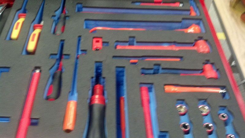 A bunch of tools are lined up on a table | Autotrends