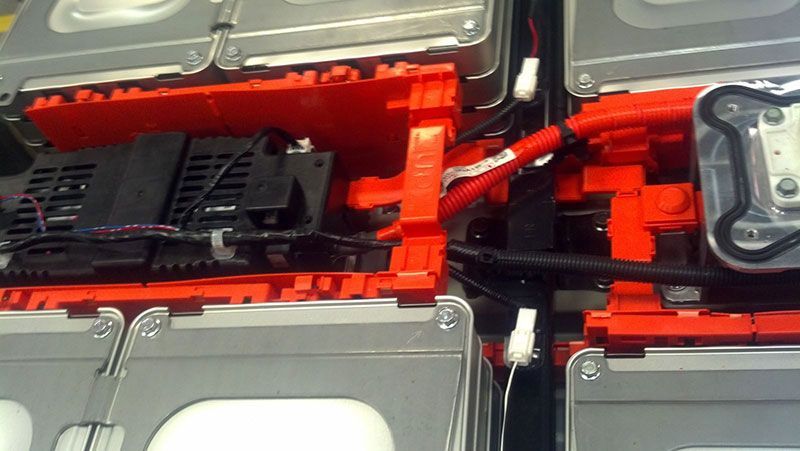 A close up of a battery with wires coming out of it | Autotrends