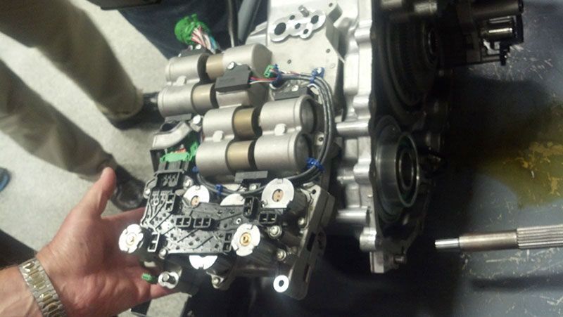 A person is holding a piece of metal in their hand | Autotrends