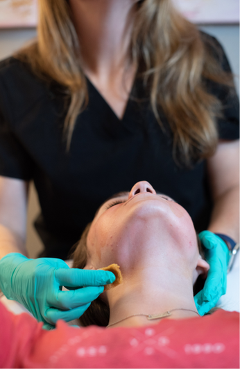 Woman receiving treatment at Sculpt Skin Solutions 