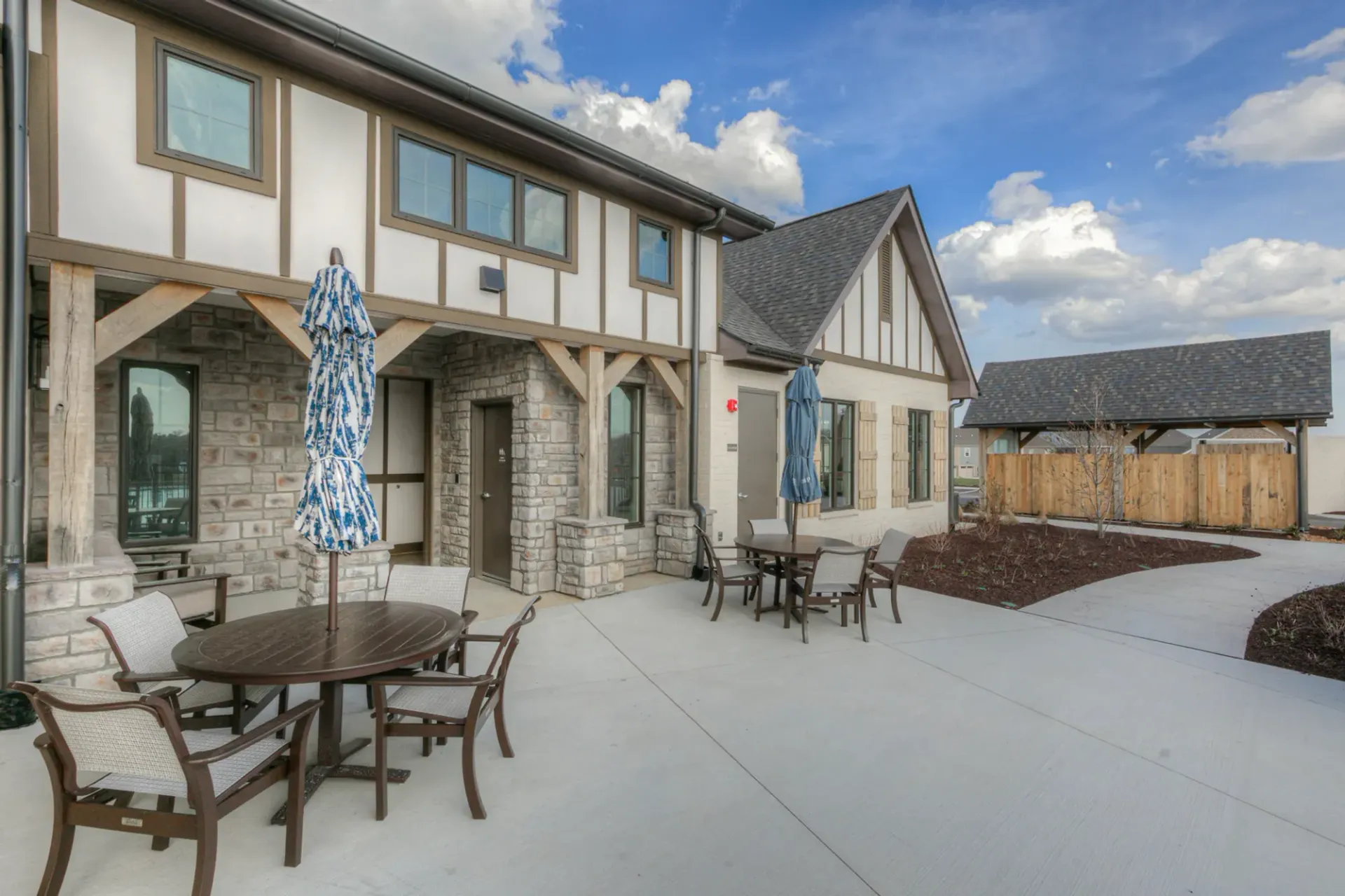 An aerial view of a residential area with a sunset in the background.
