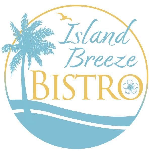 A young boy is sitting on a seesaw in a park.