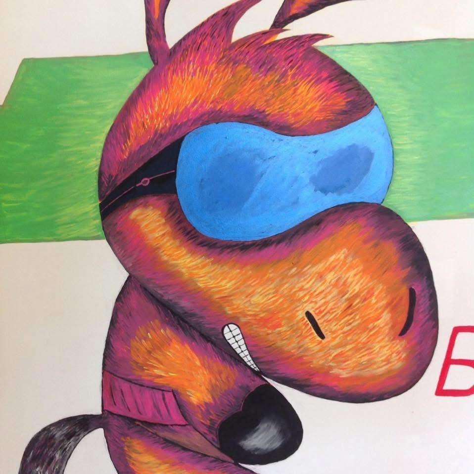 A group of people are walking and riding bikes in a park