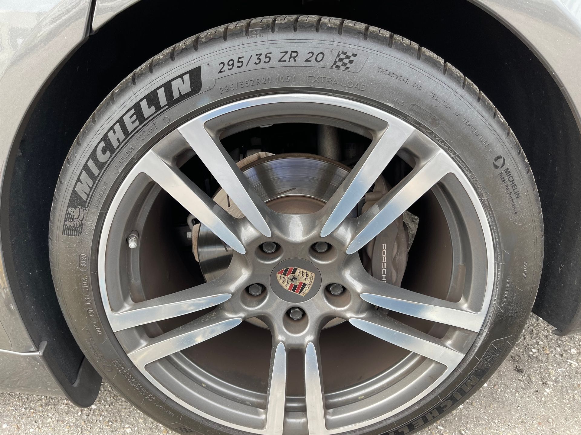 A close up of a michelin tire on a car