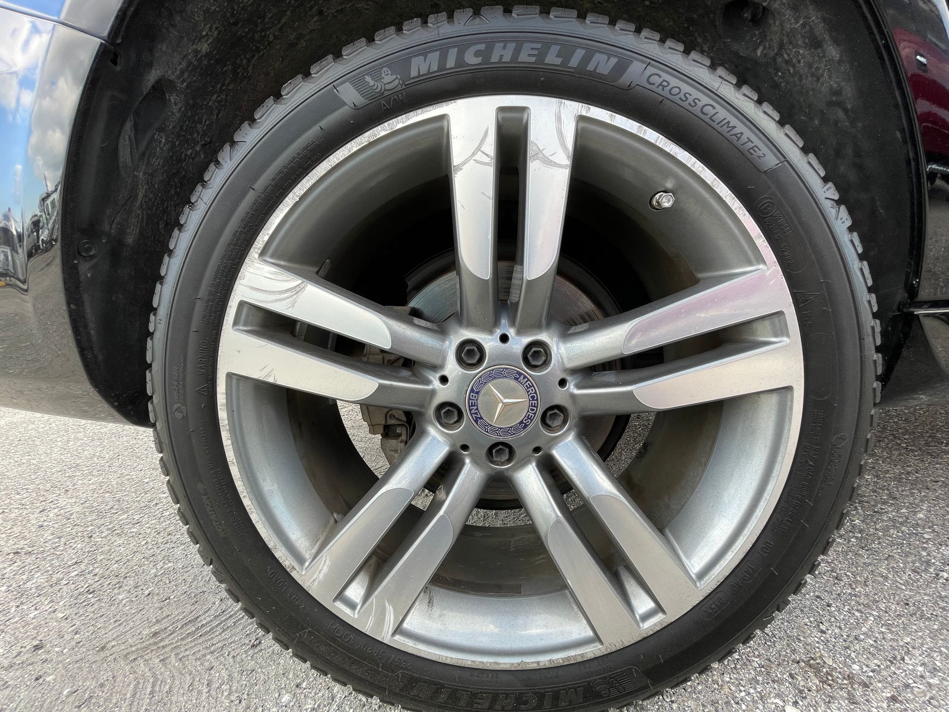 A close up of a car wheel with a michelin tire on it