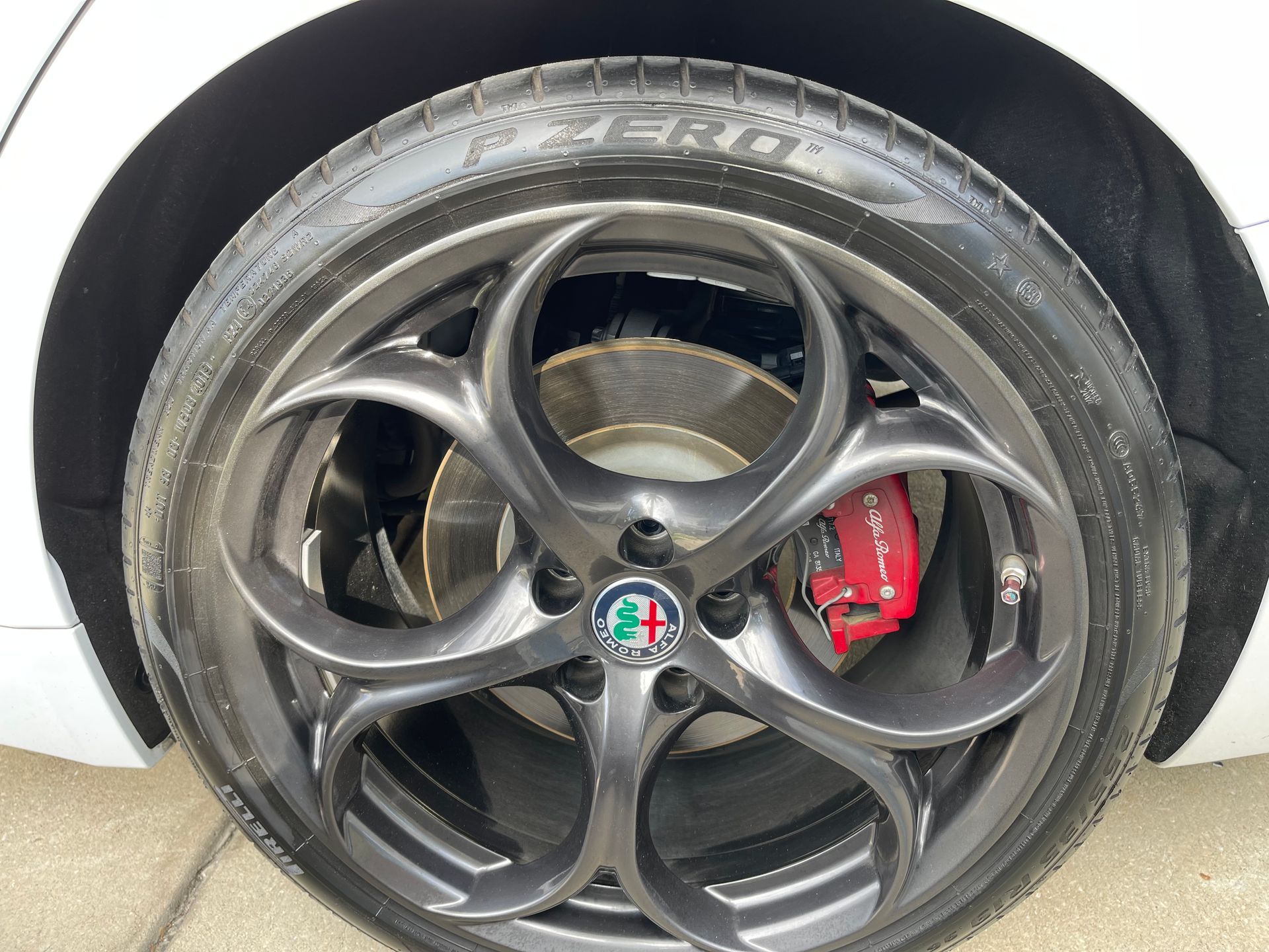 A close up of a car wheel with a tire on it