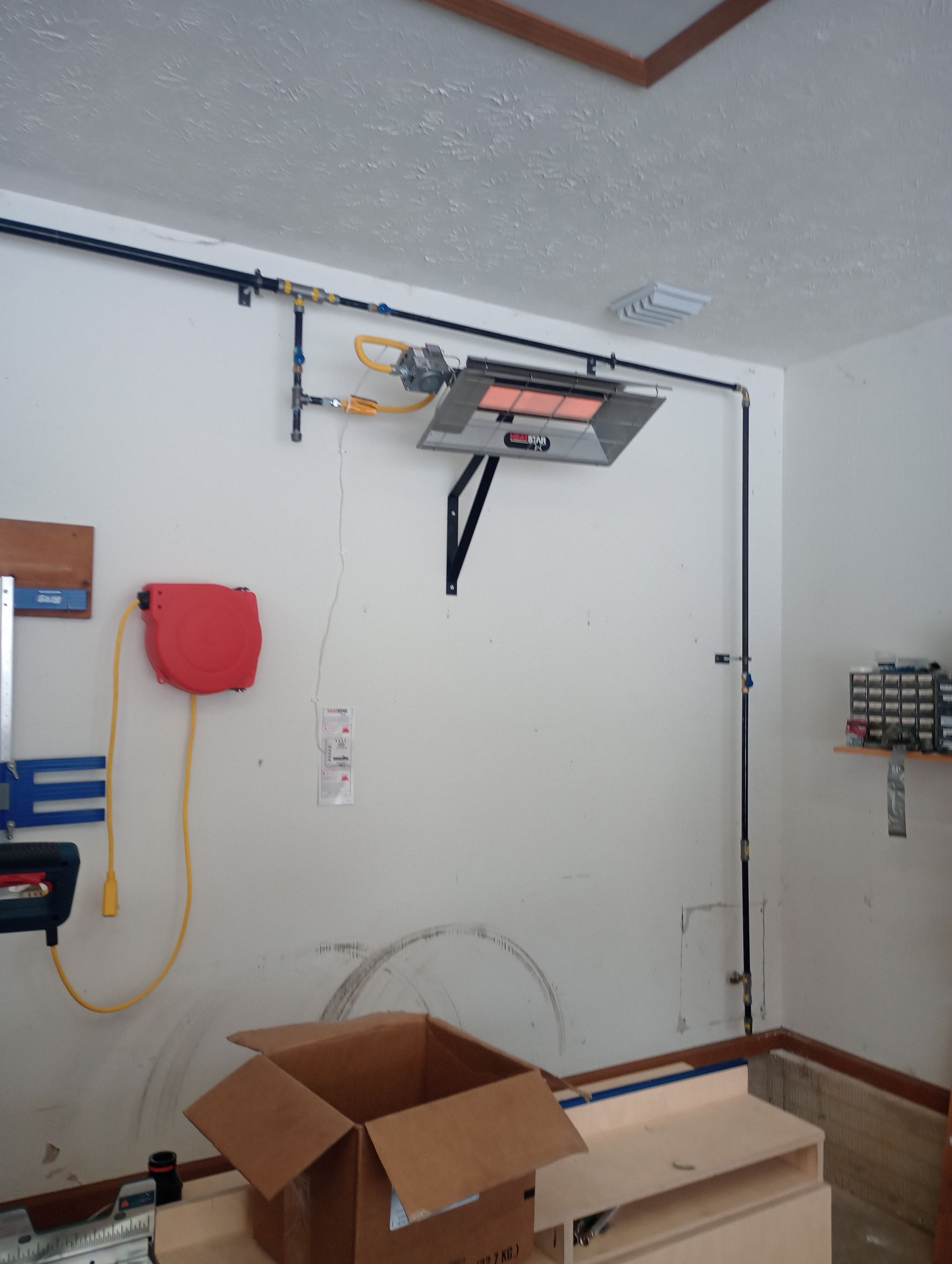 A man is loading boxes into the back of a van.