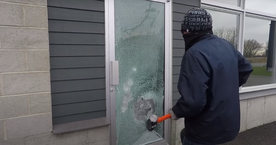 Glass does not shatter after several hits with a sledgehammer, and kicking.