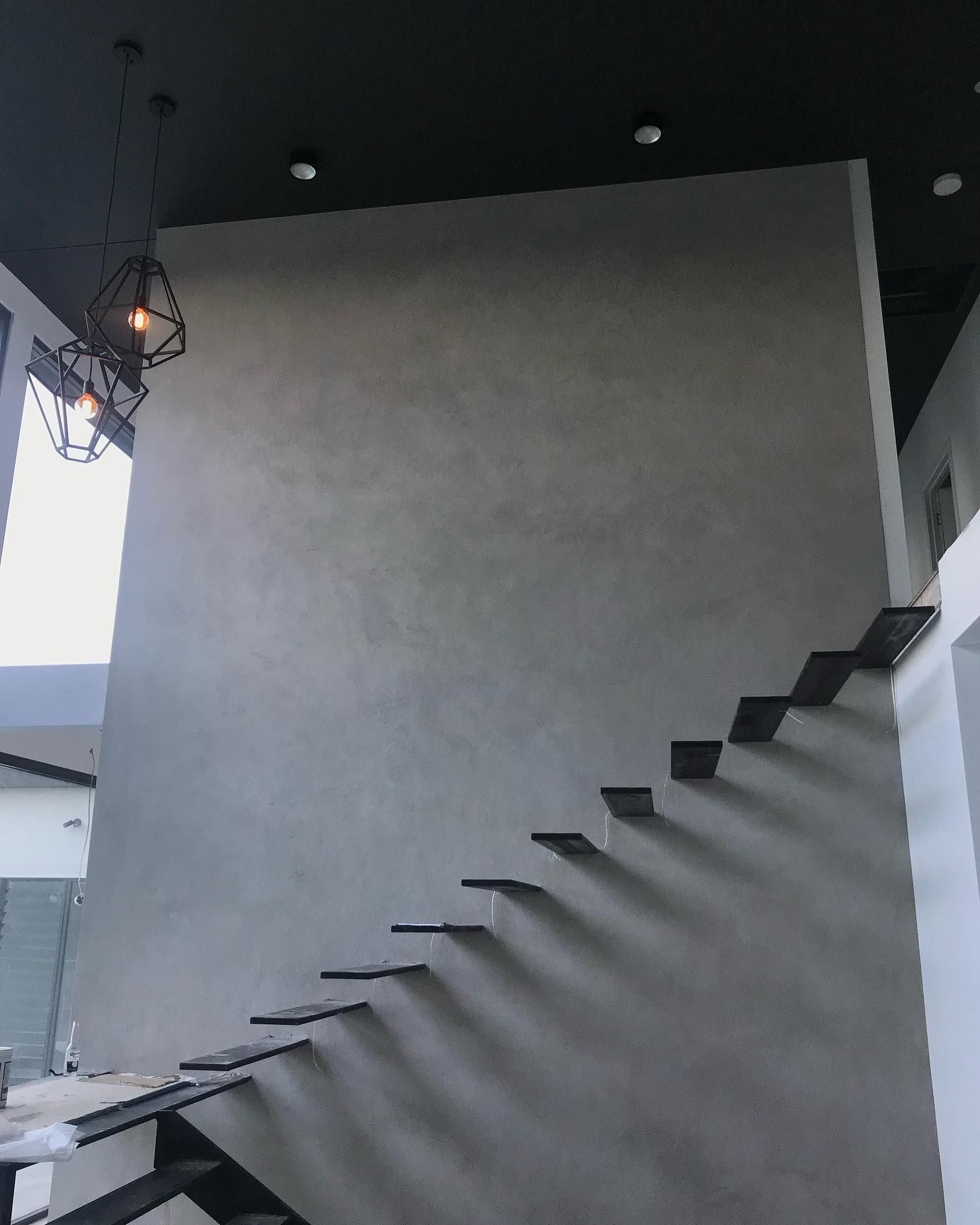 A Staircase With a Black Ceiling — Dezigner Finishes Professional Painting & Decorating in Palmview, QLD