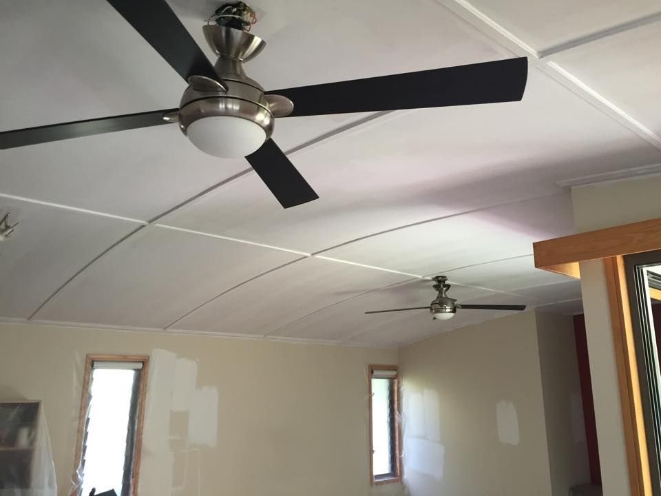A Fans Are Hanging From the Ceiling of a Room — Dezigner Finishes Professional Painting & Decorating in Sunshine Beach, QLD