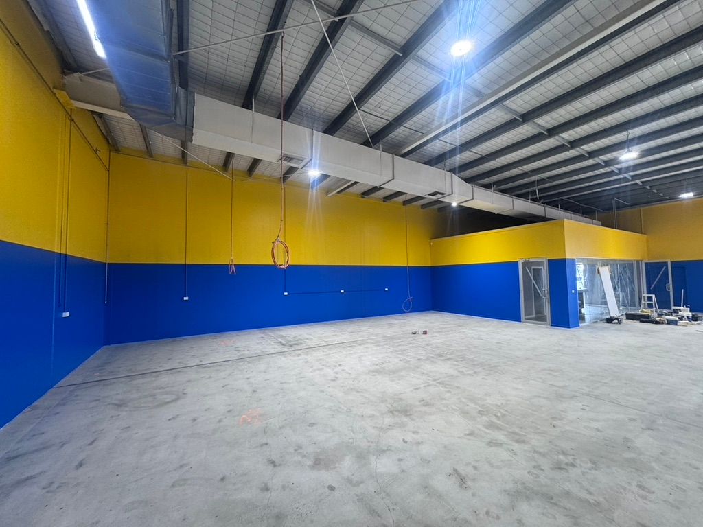 A Building With a Lot of Windows — Dezigner Finishes Professional Painting & Decorating in Caloundra, QLD