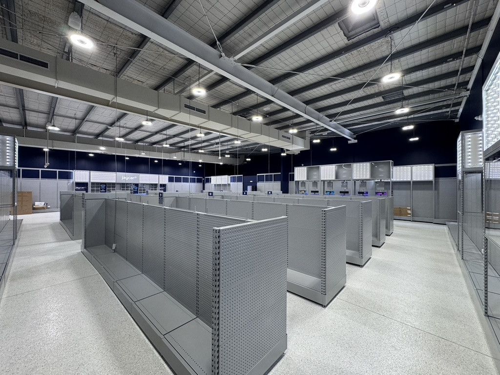 A Crane is Cleaning a Building — Dezigner Finishes Professional Painting & Decorating in Noosa Heads, QLD