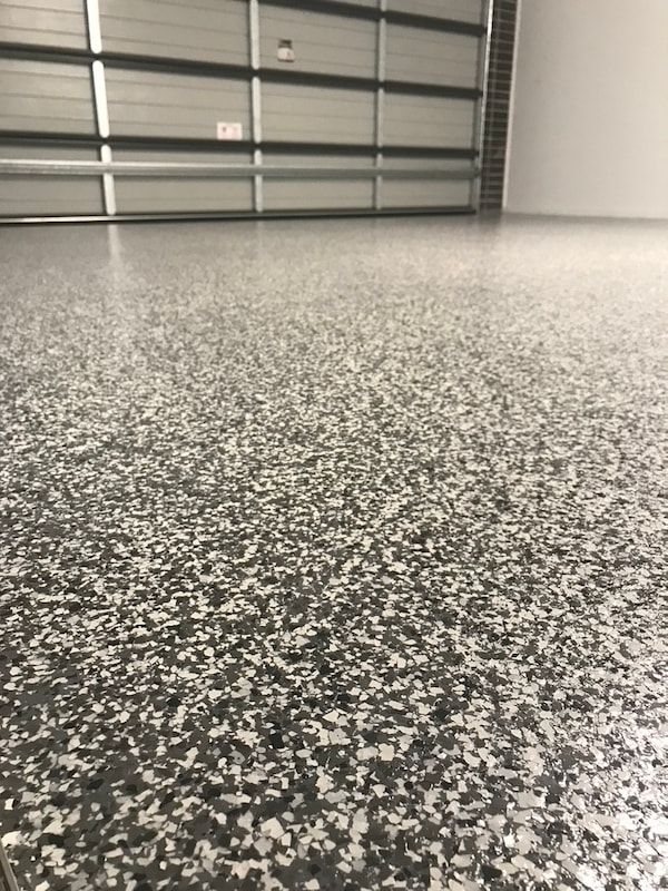 A Close Up of a Garage Floor — Dezigner Finishes Professional Painting & Decorating in Palmview, QLD