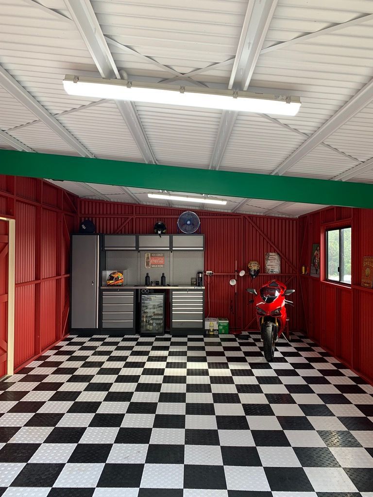 A Motorcycle is Parked in a Garage — Dezigner Finishes Professional Painting & Decorating in Kunda Park, QLD