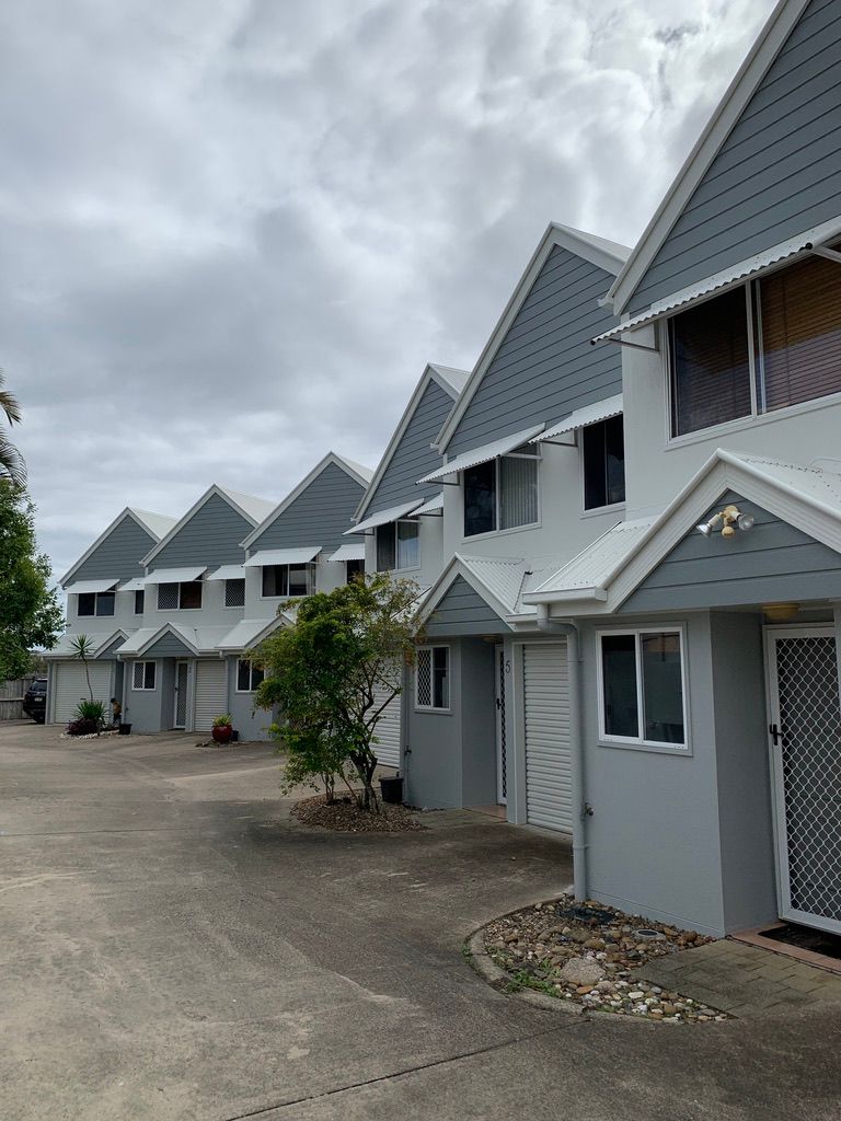 A Row of Houses With a Lot of Windows — Dezigner Finishes Professional Painting & Decorating in Maroochydore, QLD