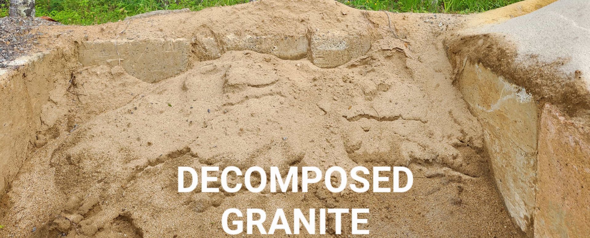 A pile of decomposed granite is sitting on top of a pile of sand. — T&G Sand and Gravel In Sippy Downs, QLD
