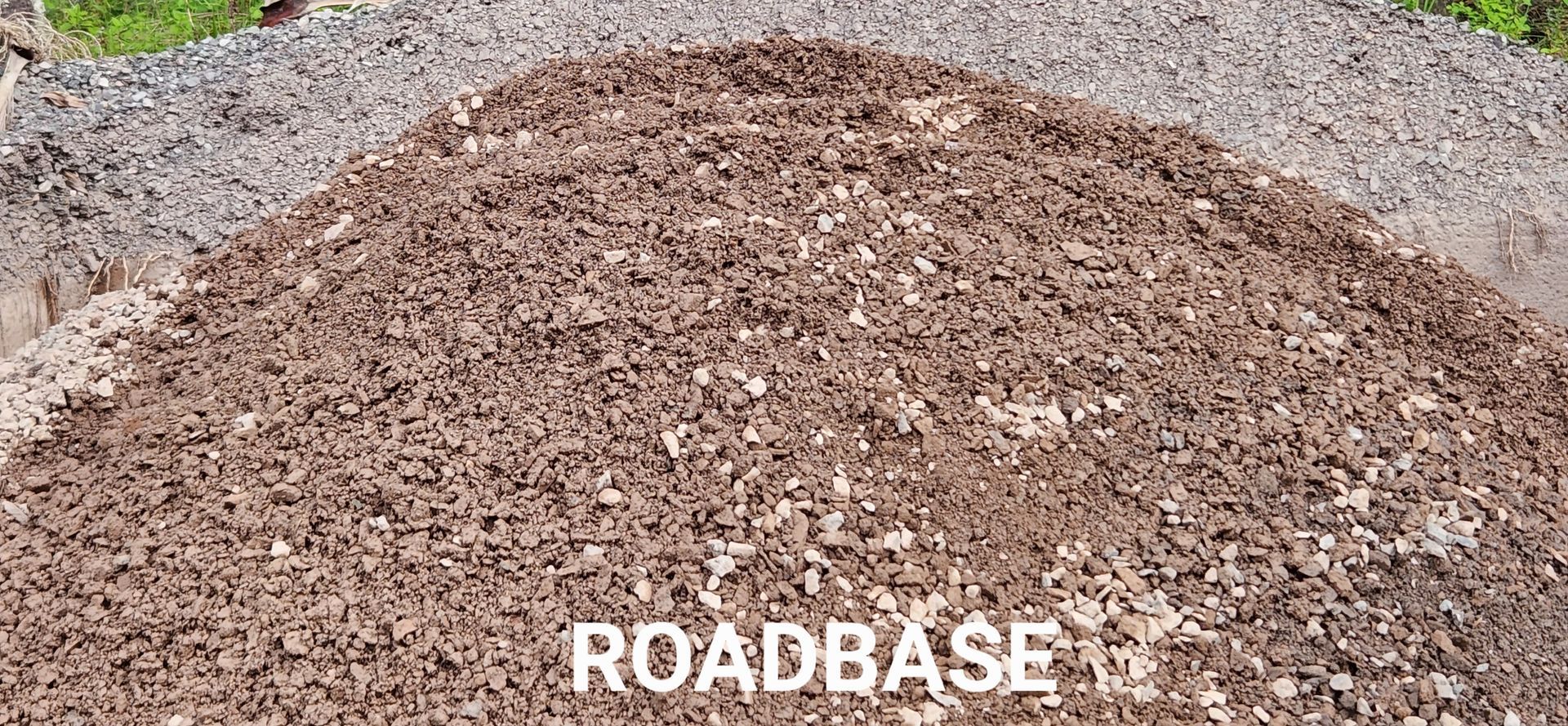 A pile of gravel is sitting on top of a pile of dirt. — T&G Sand and Gravel In Sippy Downs, QLD