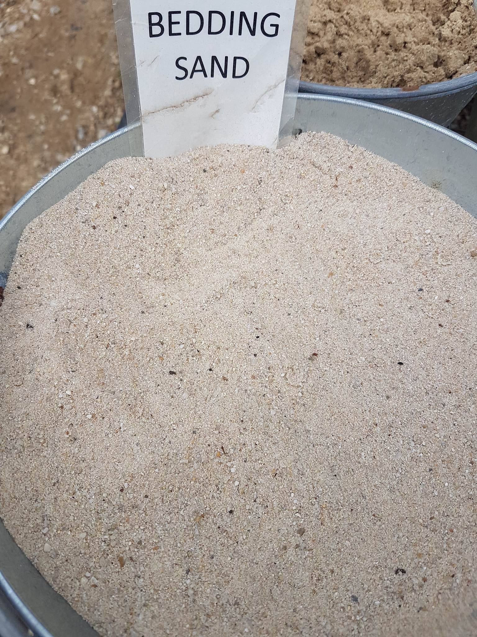 A Pile Of Sand With A Sign That Says Bedding Sand — T&G Sand and Gravel In Sippy Downs, QLD