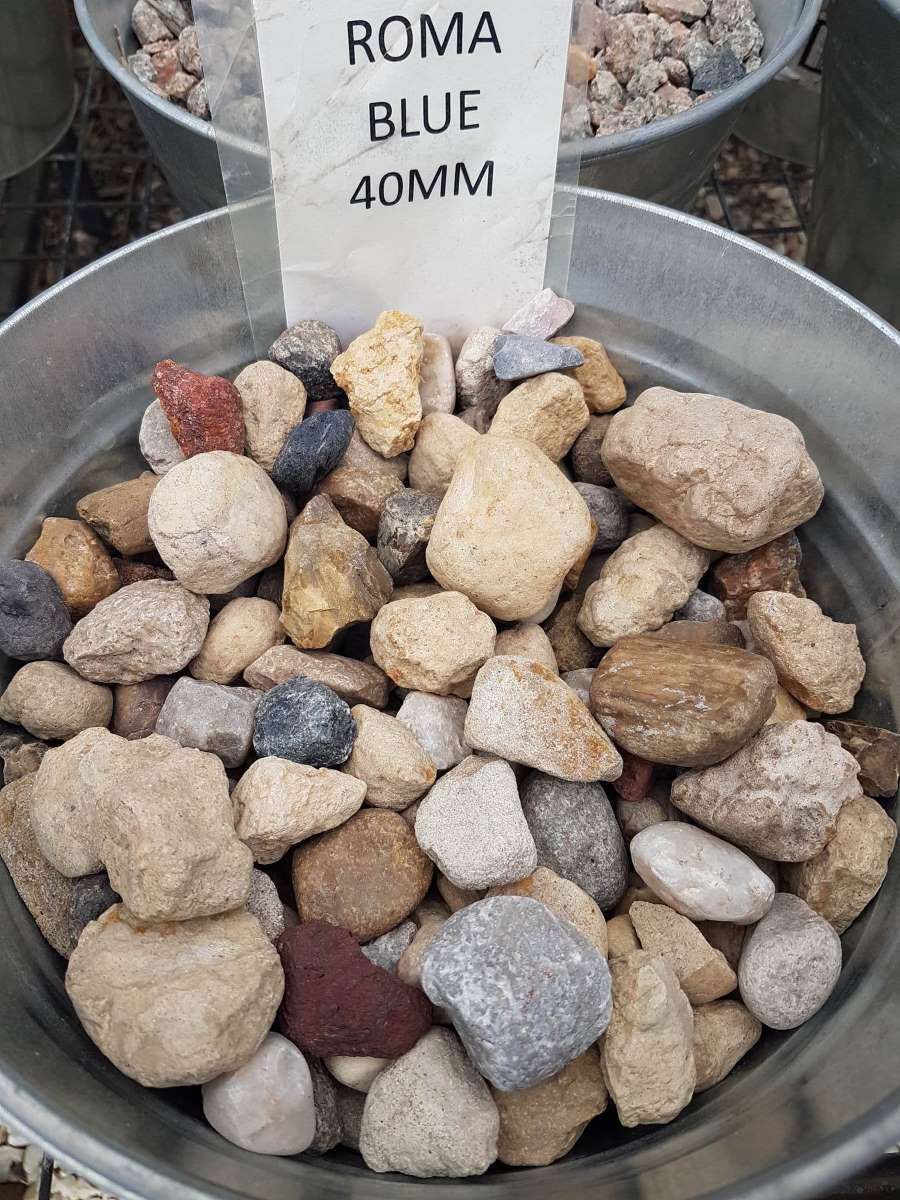 A Metal Bowl Filled With Rocks And A Sign That Says Roma Blue 40mm — T&G Sand and Gravel In Sippy Downs, QLD