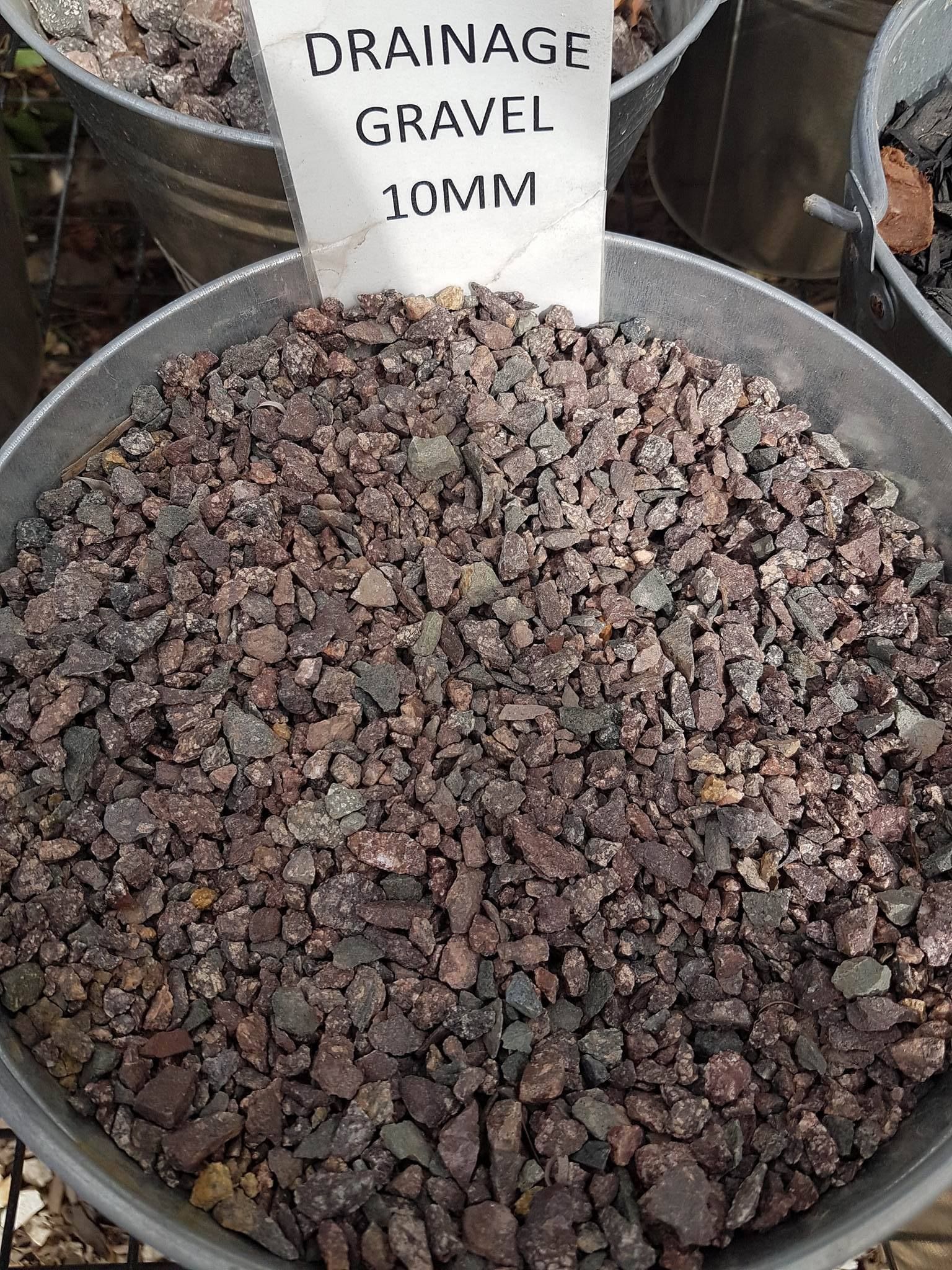 A Metal Bowl Filled With Gravel And A Sign That Says — T&G Sand and Gravel In Sippy Downs, QLD