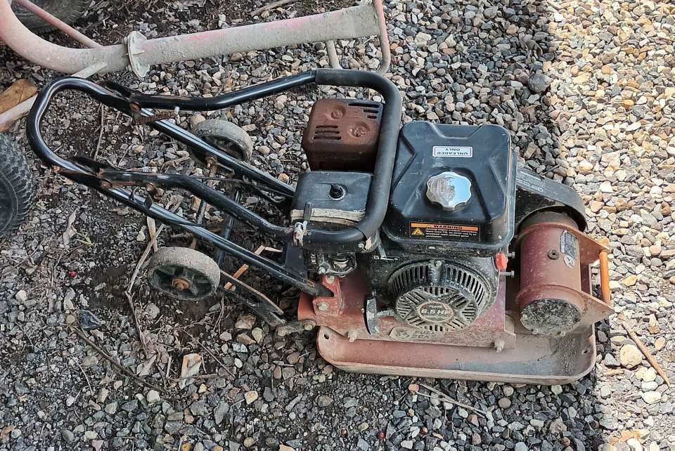 A Lawn Mower is Sitting on a Pile of Gravel — T&G Sand and Gravel In Sippy Downs, QLD