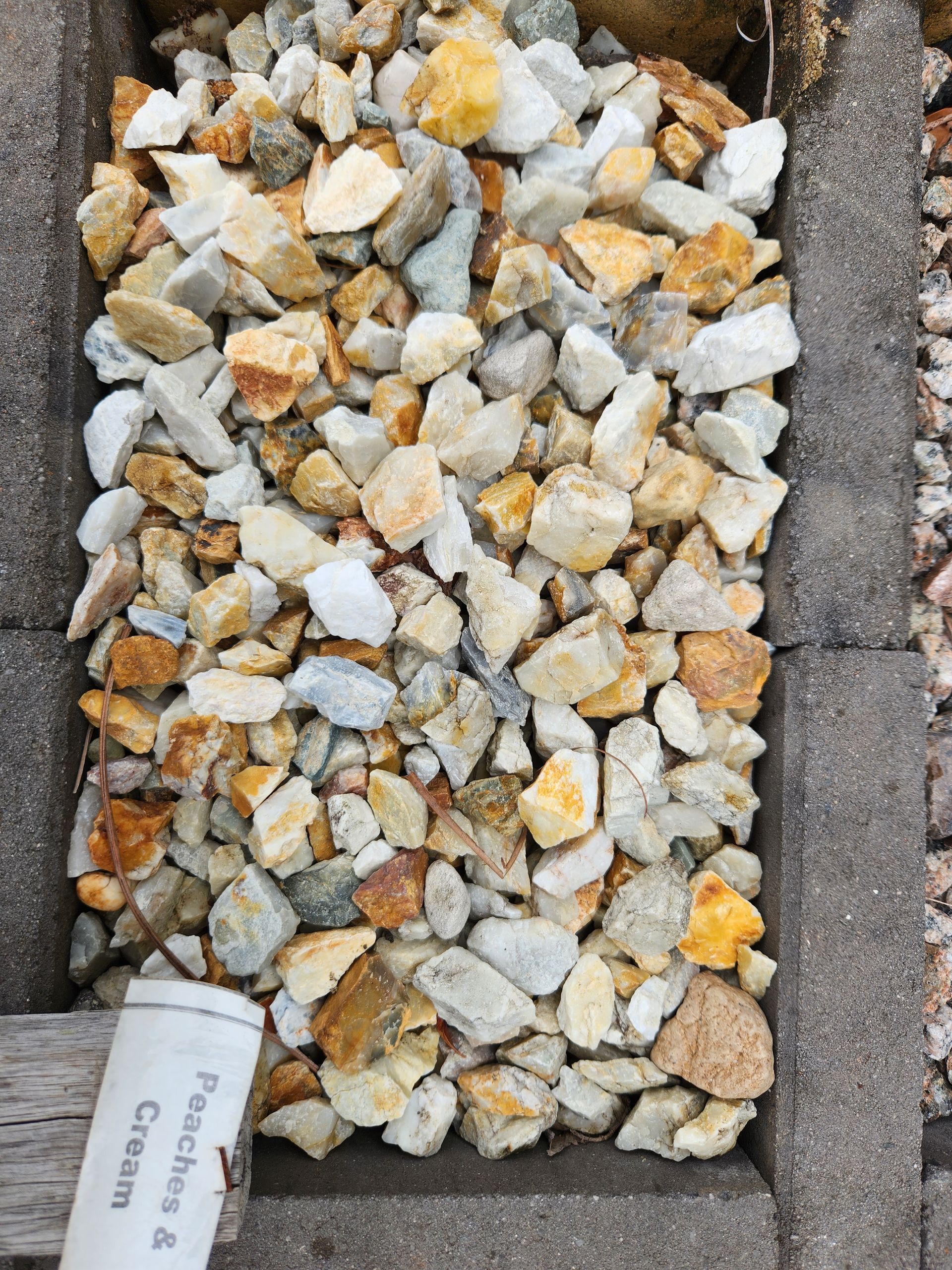 Close-up of a Rectangular Container With Light-colored Irregular Rocks — T&G Sand and Gravel In Sippy Downs, QLD