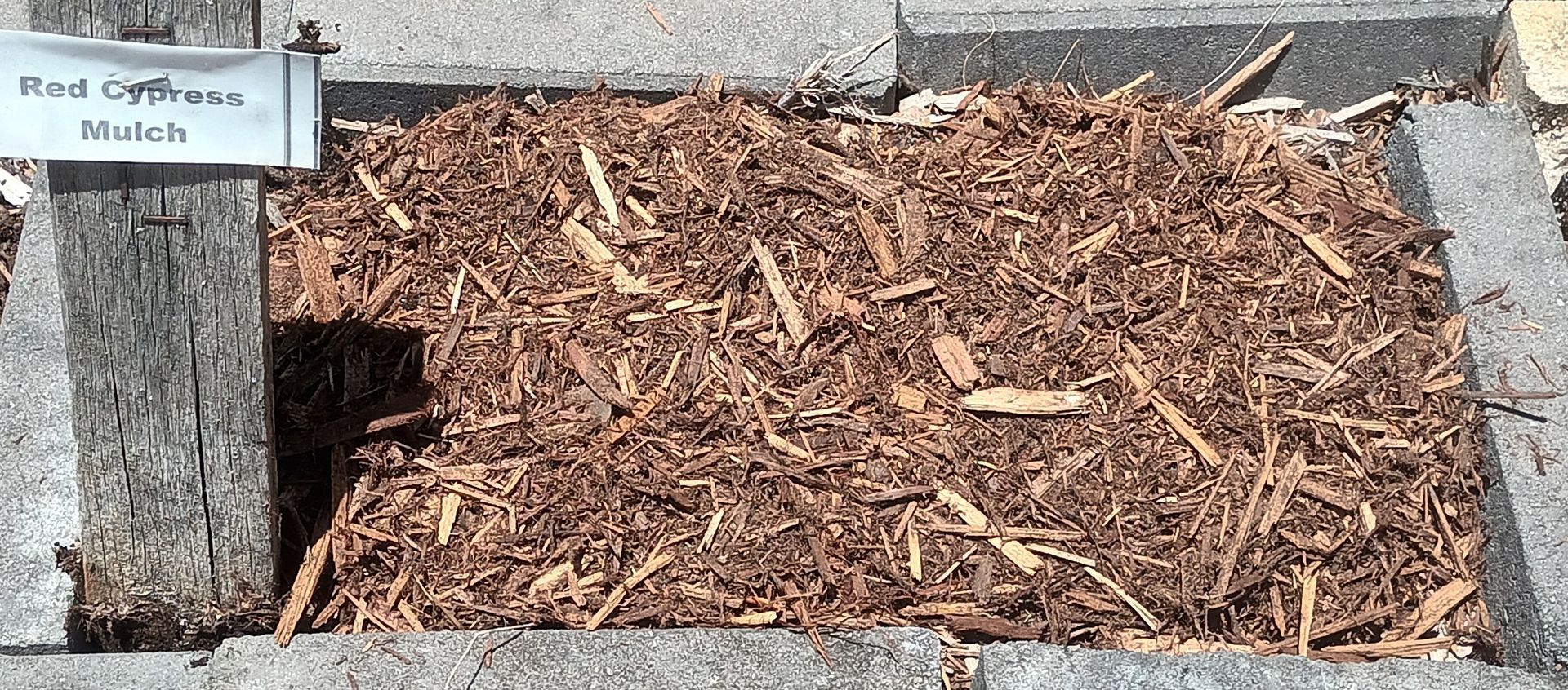 A Pile Of Red Cypress Mulch— T&G Sand and Gravel In Sippy Downs, QLD