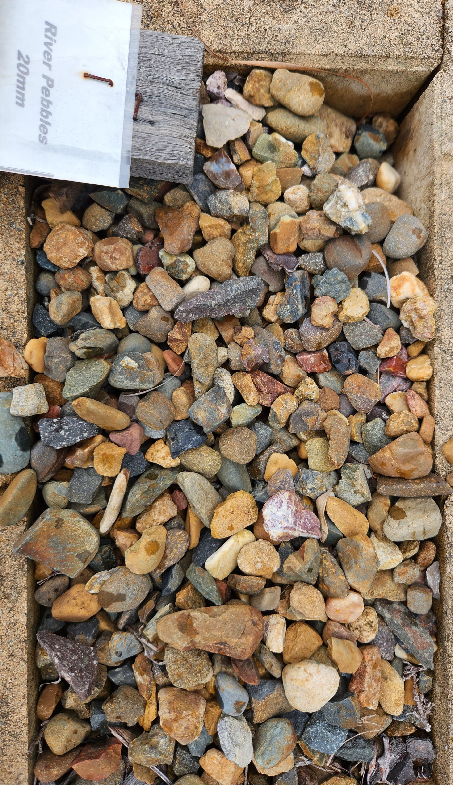 Gravel Bed With Tan and Gray Stones — T&G Sand and Gravel In Sippy Downs, QLD