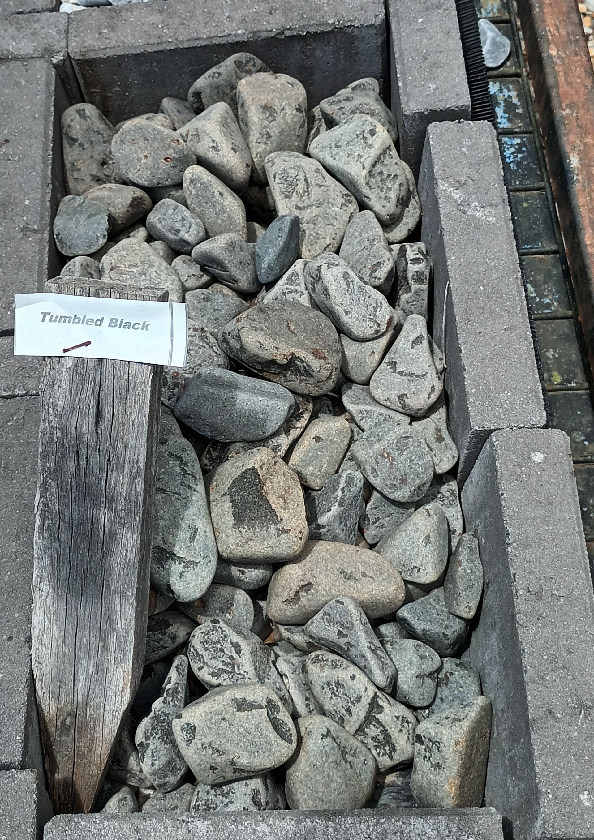 A Pile of Tumbled Black Stones— T&G Sand and Gravel In Sippy Downs, QLD