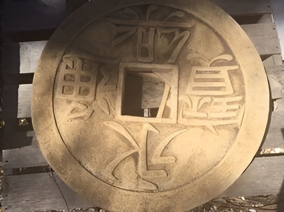A Large Coin With Chinese Writing On It — T&G Sand and Gravel In Sippy Downs, QLD