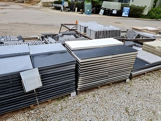 A Bunch Of Tiles Are Stacked On Top Of Each Other In A Yard — T&G Sand and Gravel In Sippy Downs, QLD