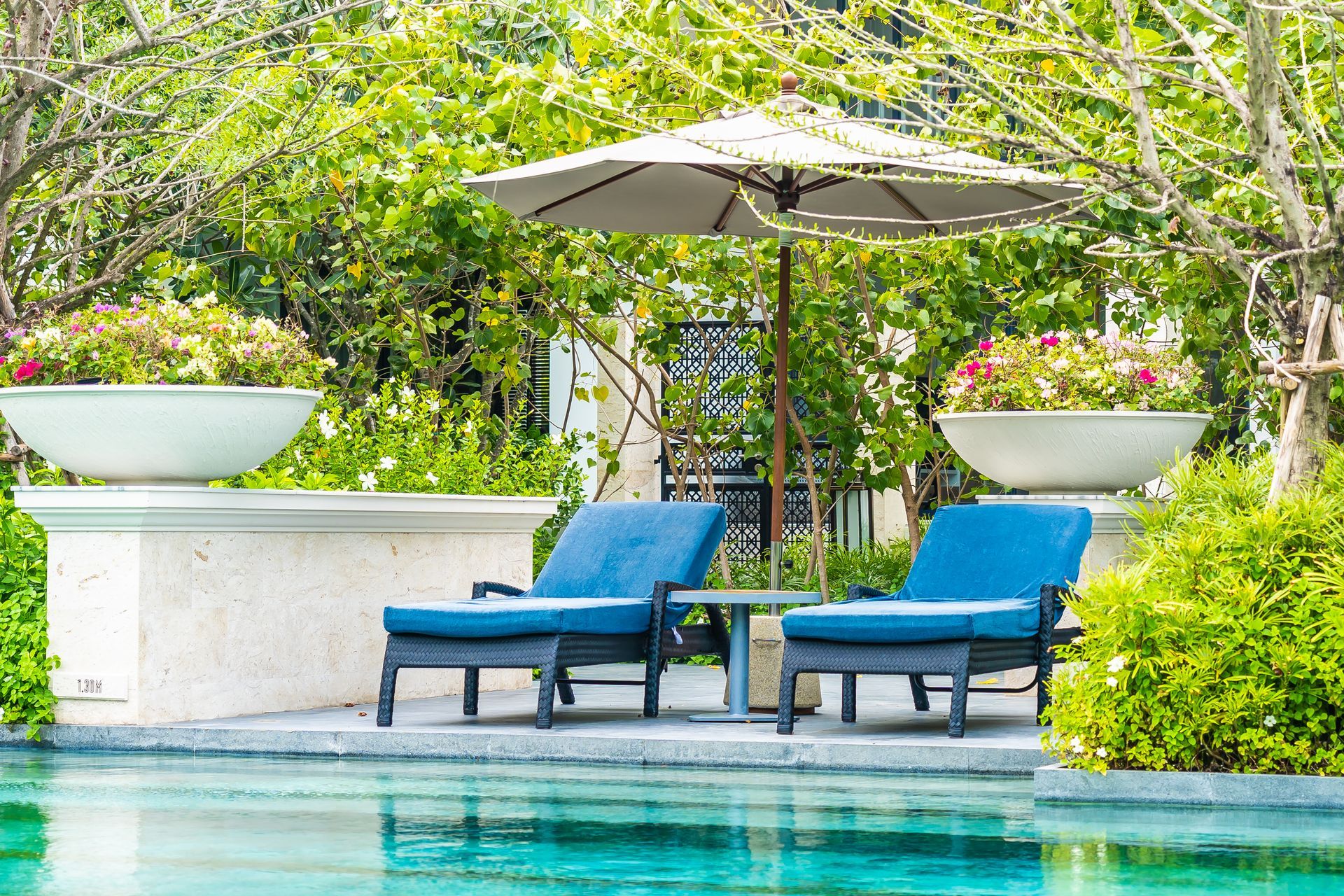 pool area with blue chairs