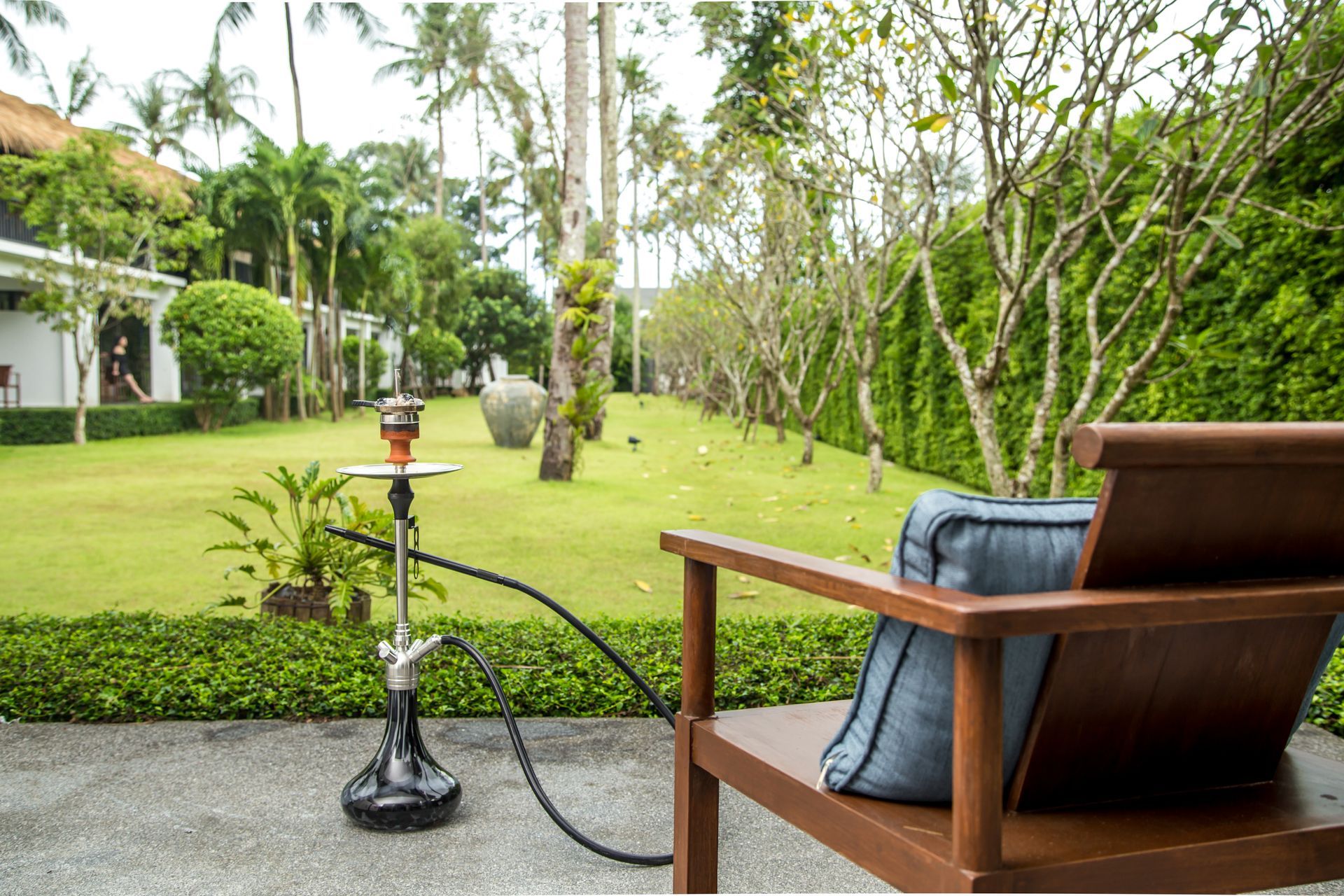 hookah alongside a chair near the garden area