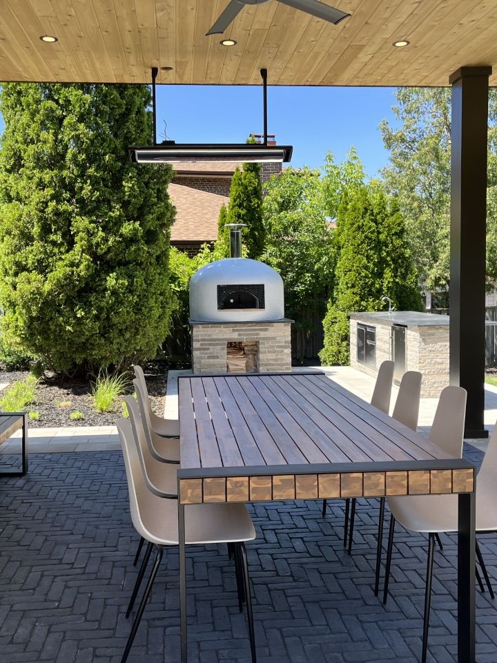backyard with dining area and pizza oven