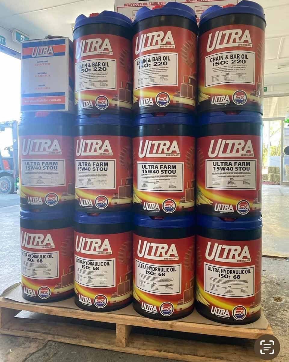 A Bunch Of Barrels Of Oil Are Stacked On Top Of Each Other On A Wooden Pallet — Dillon Rural In Port Macquarie, NSW