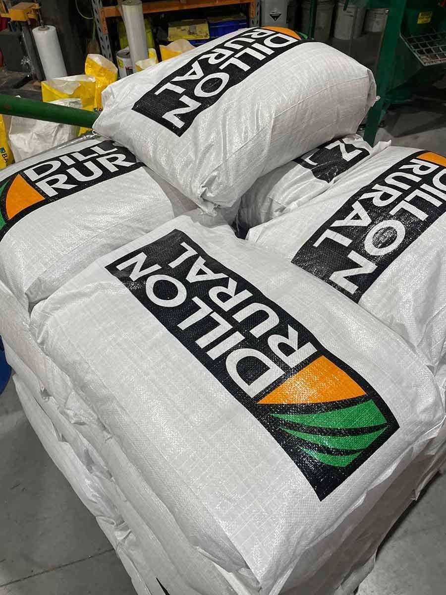 Three Bags Of Dillon Rural Fertilizer Are Stacked On Top Of Each Other — Dillon Rural In Kew, NSW
