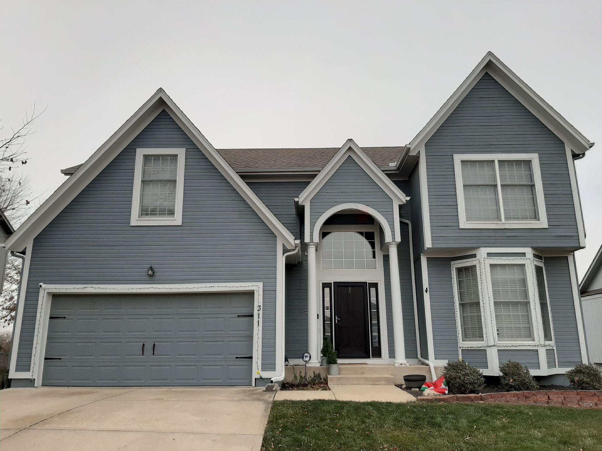 Home Pros Painting and Home Repairs  exterior house painted before Olathe KS