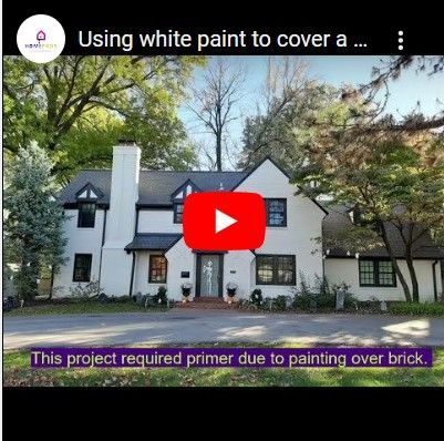 Can white exterior paint cover dark paint?