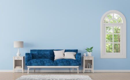 Home living room interior highlighting a clean, well-painted blue wall