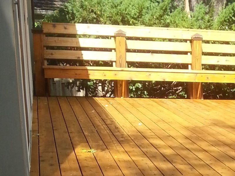 Wood deck well-maintained, freshly stained in light color