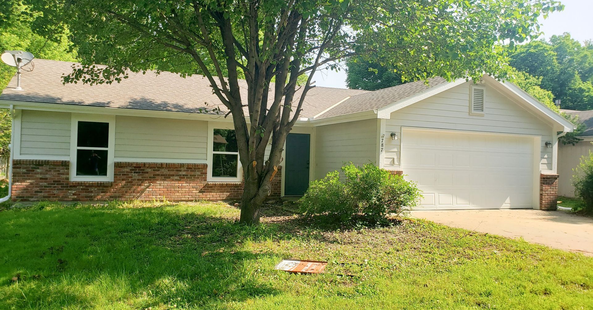 Home Pros Painting exterior house painted after Lawrence KS