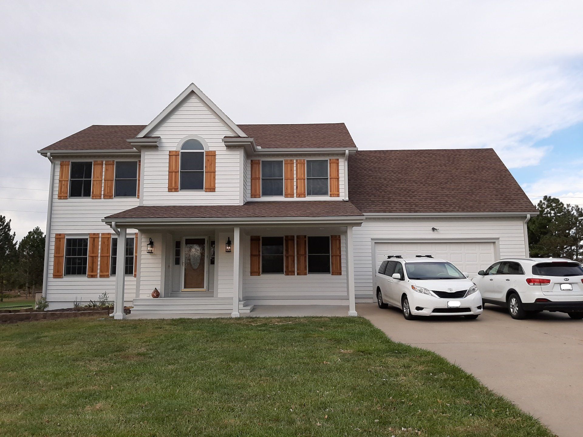 exterior of house painted white by Home Pros