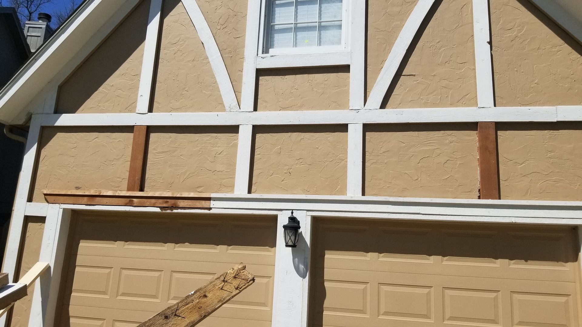 new wood trim installed on exterior of house in lenexa ks by home pros painting