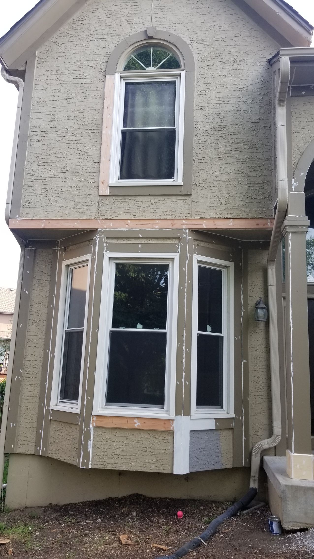 exterior of house in shawnee ks having wood trim replaced and painted from home pros painting