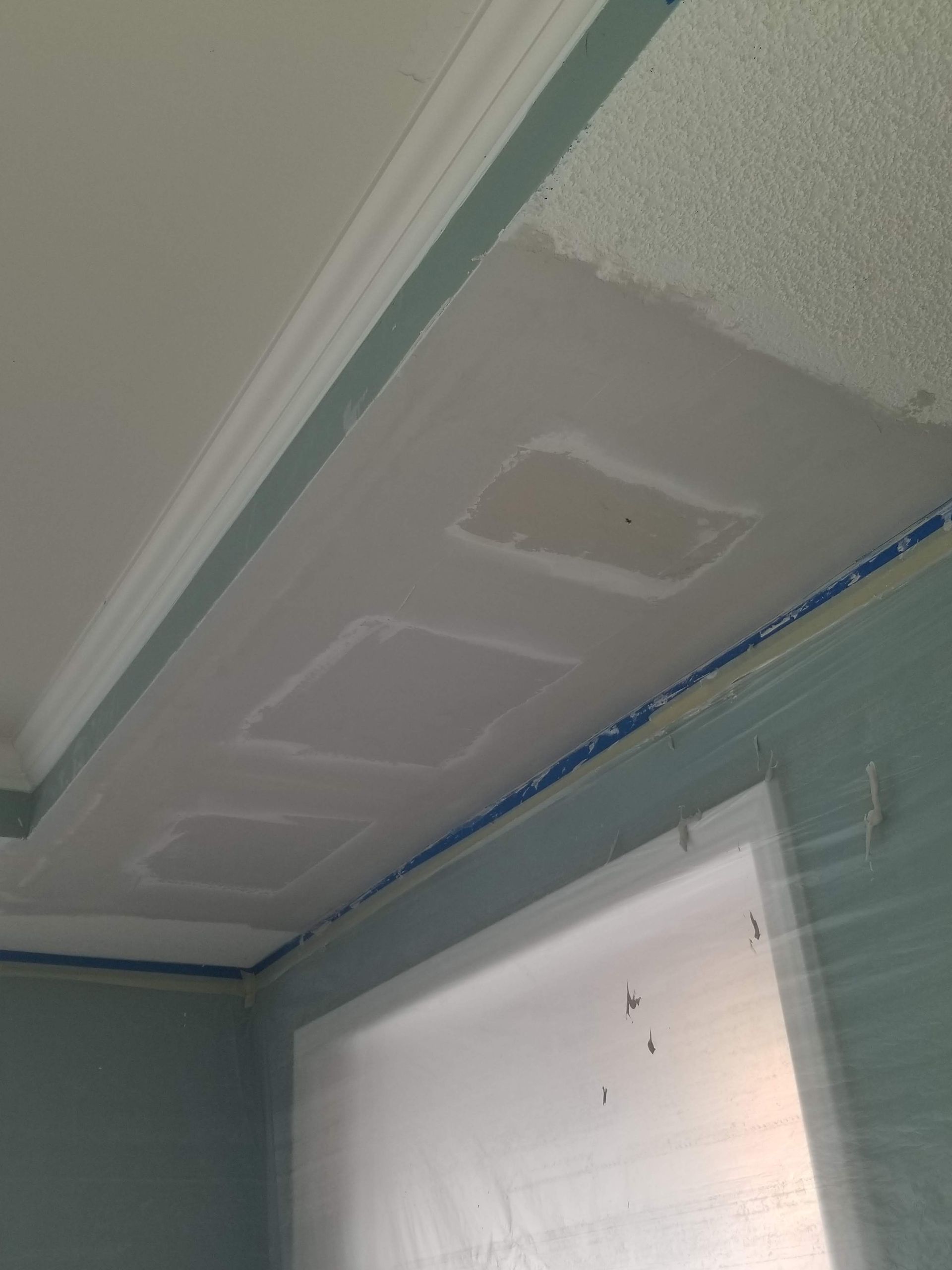 new drywall installed during ceiling repair and popcorn texture match